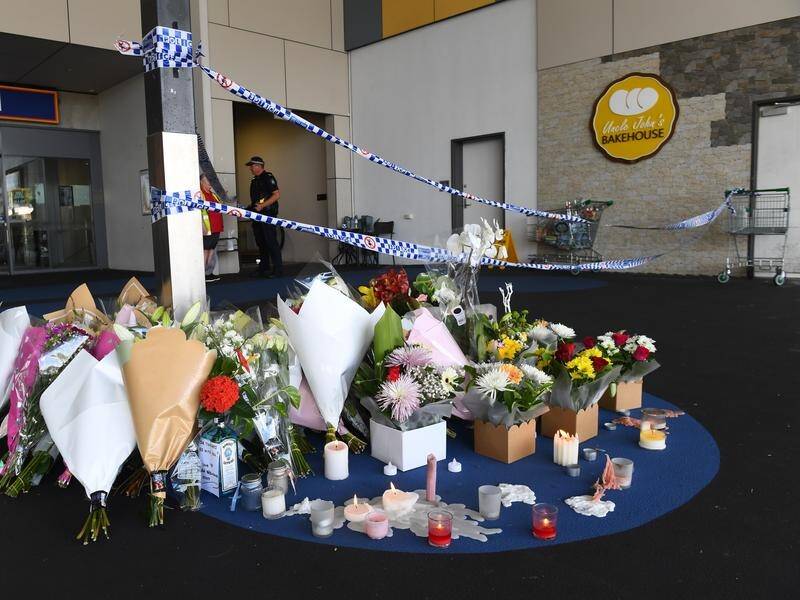 Tributes for grandmother Vyleen White have been left at the entrance to Town Square mall. (Jono Searle/AAP PHOTOS)