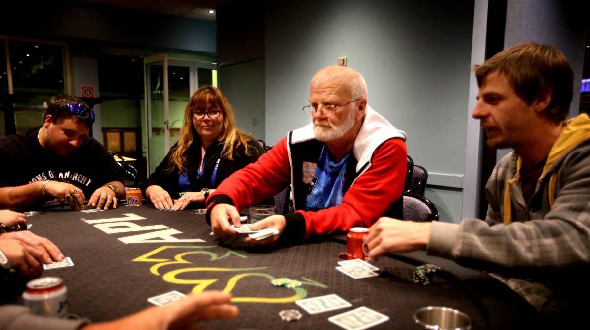 NCH - NEWS - Retiree Jon Campbell [red sleeves] is heading to Las Vegas to compete in the world series of poker - shows him playing poker with his friends at the Five Islands Recreation Club at Speers Point -     19th June  2014 photo by Peter Stoop