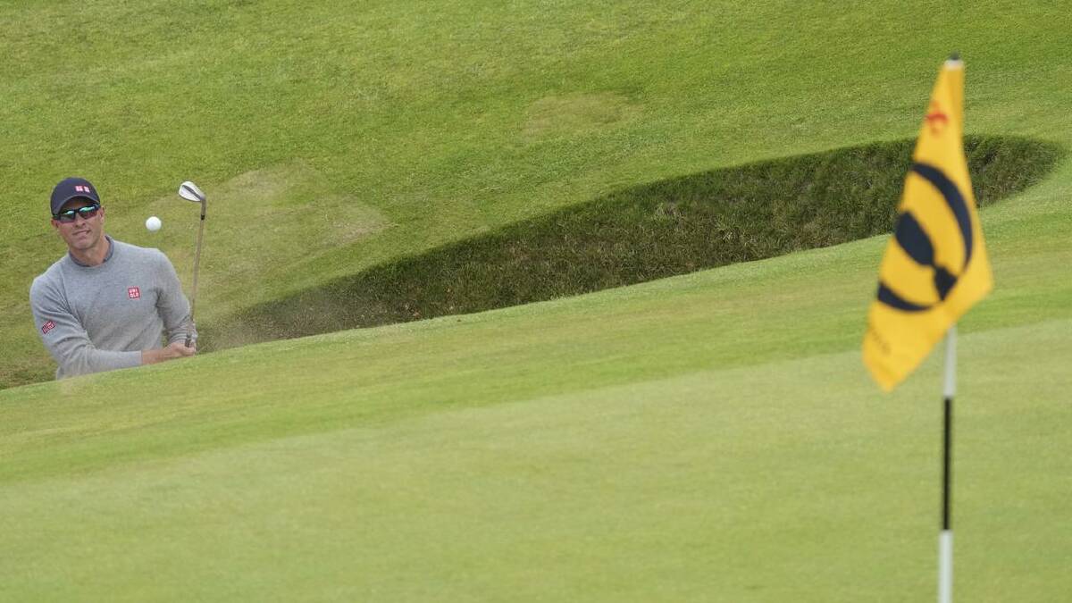 Bunker trouble at the Postage Stamp cost Adam Scott a double bogey. (AP PHOTO)
