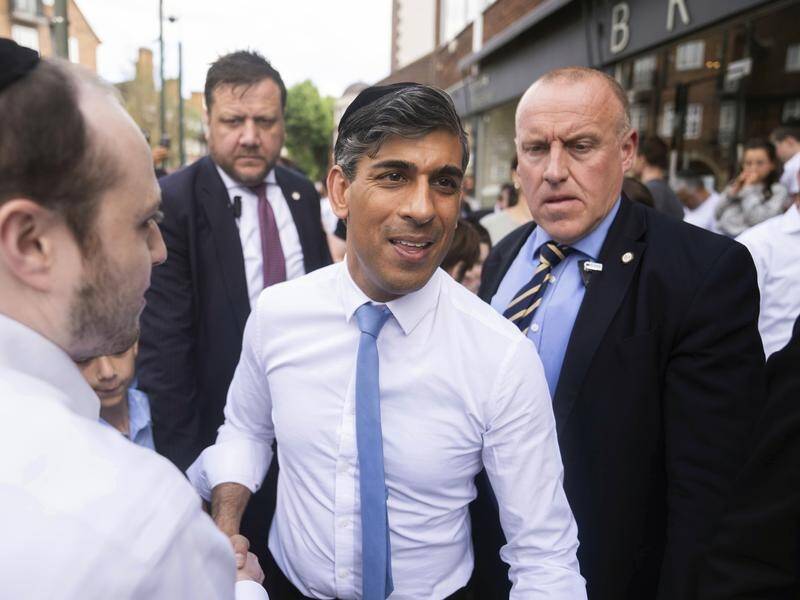 Prime Minister Rishi Sunak argues his policies have begun to solve the country's problems. (AP PHOTO)