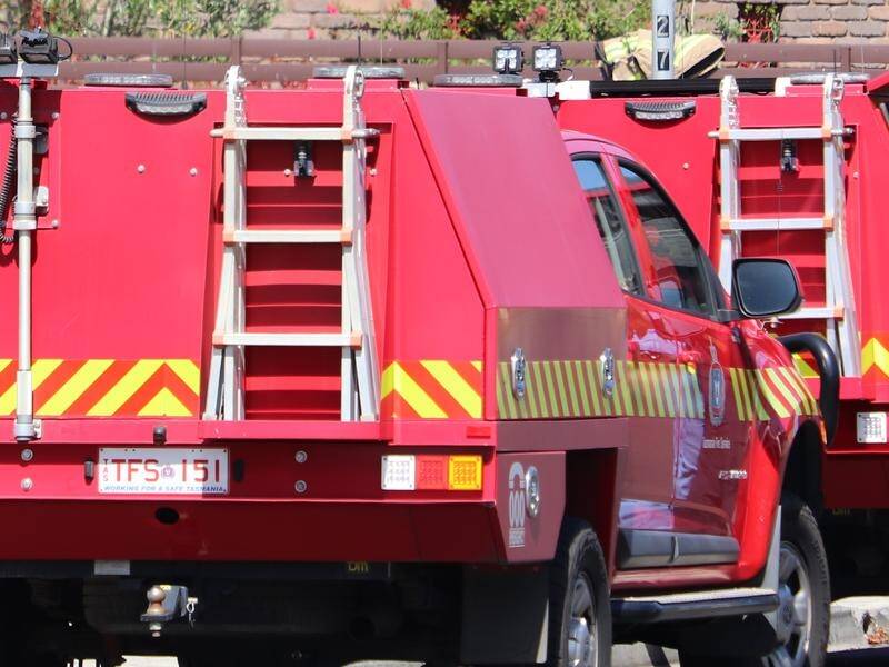 A body has been found and a woman has been taken to hospital after a house fire in Tasmania. (Ethan James/AAP PHOTOS)