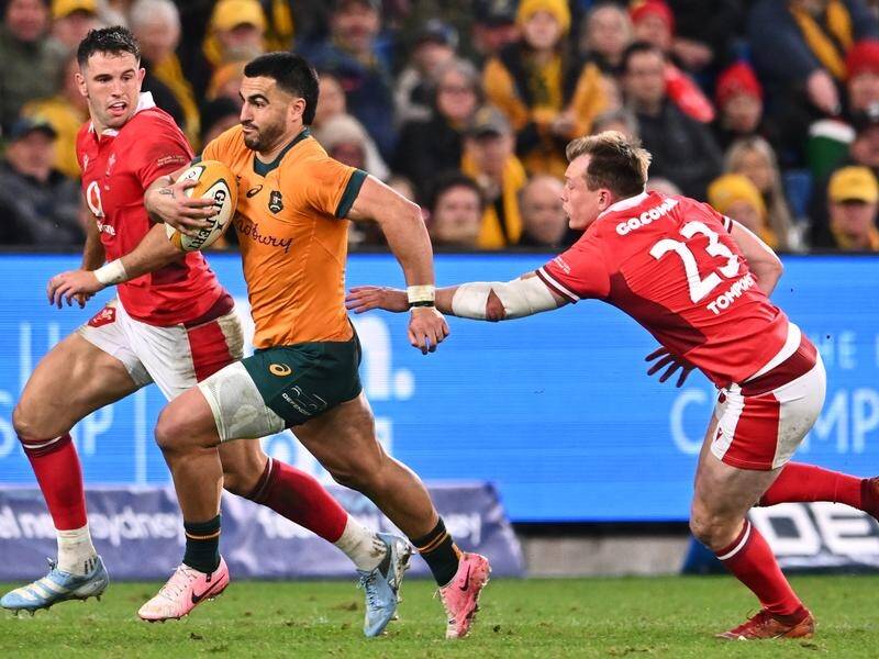 An electrifying 68-metre solo try to Tom Wright sealed victory for the Wallabies over Wales. (James Gourley/AAP PHOTOS)