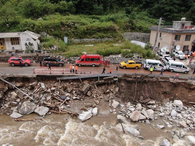 Twenty-one people are confirmed dead after a mudslide on the outskirts of Chang'an District, Xian. (EPA)