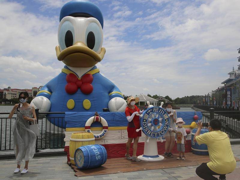 Visitors to Shanghai's Disney Resort must stay in the park until they return a negative COVID test. (AP PHOTO)