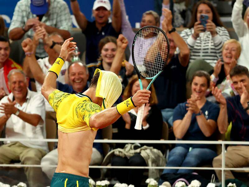 Matt Ebden celebrates winning a game against the great Novak Djokovic at the Olympics. Photo: EPA PHOTO