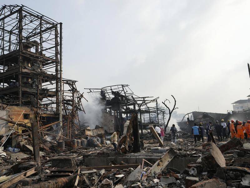 Rescue teams are combing the site of a deadly explosion and fire at a chemical factory near Mumbai. (AP PHOTO)