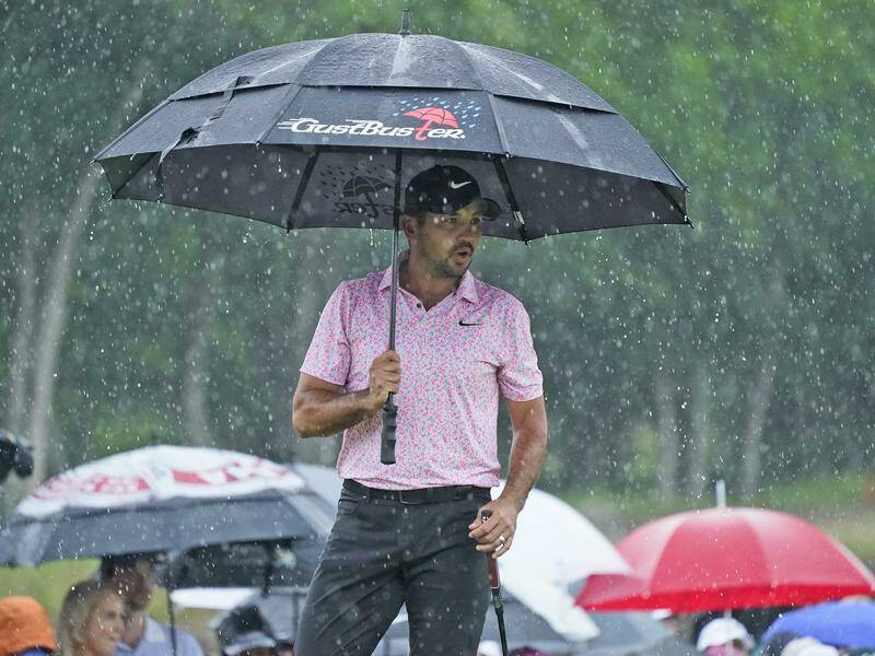 According to his wife, Jason Day thrives on the golf course the worse the weather gets. Photo: AP PHOTO