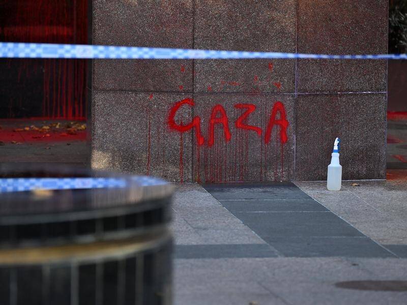 The US Consulate building in Melbourne was splashed with paint and windows were smashed. (James Ross/AAP PHOTOS)