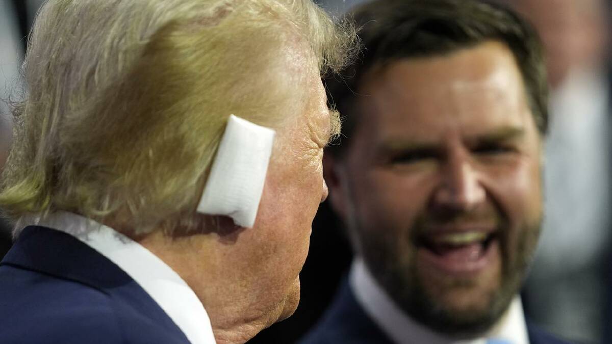 A bandage on Donald Trump's ear served as a visual reminder of an assassination bid on the weekend. (AP PHOTO)
