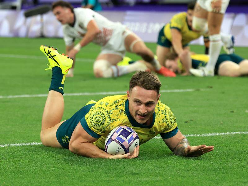 Australia's Corey Toole scores a try against the United States during their quarter-final clash. Photo: Iain McGregor/AAP PHOTOS