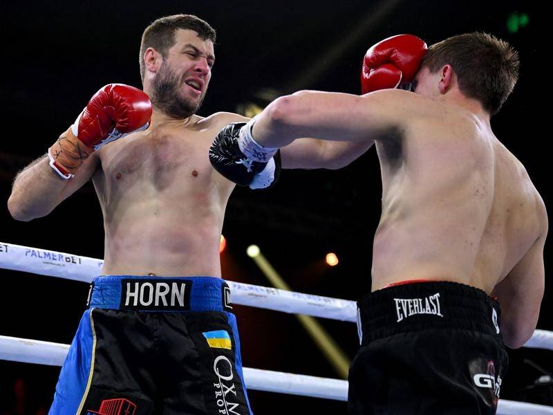 Nikita Tszyu (right) takes a blow from Ben Horn during a bout at the Hordern Pavilion in Sydney.