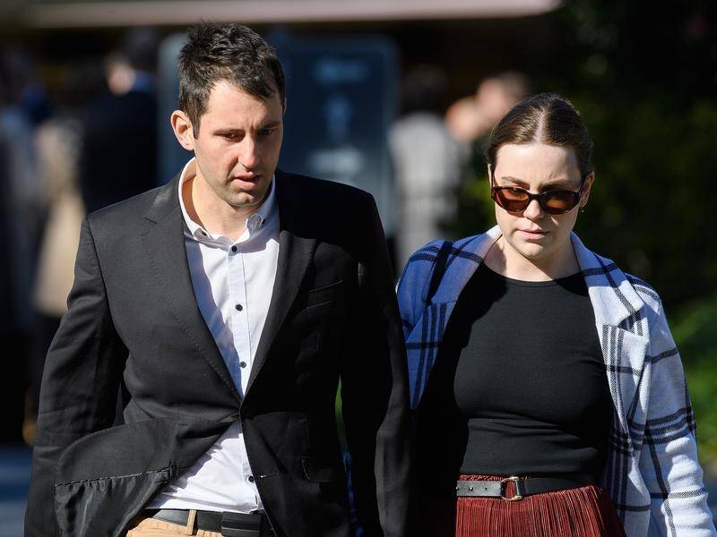 Mitchell Gaffney and Maddy Edsell at the service for bus crash victim Angus Andrew Craig in Nowra. (Bianca De Marchi/AAP PHOTOS)