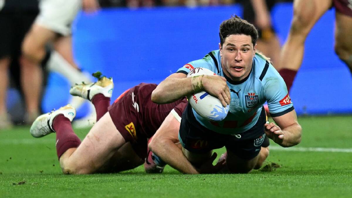 Mitchell Moses dives over for the Blues' second during Origin III. (Darren England/AAP PHOTOS)