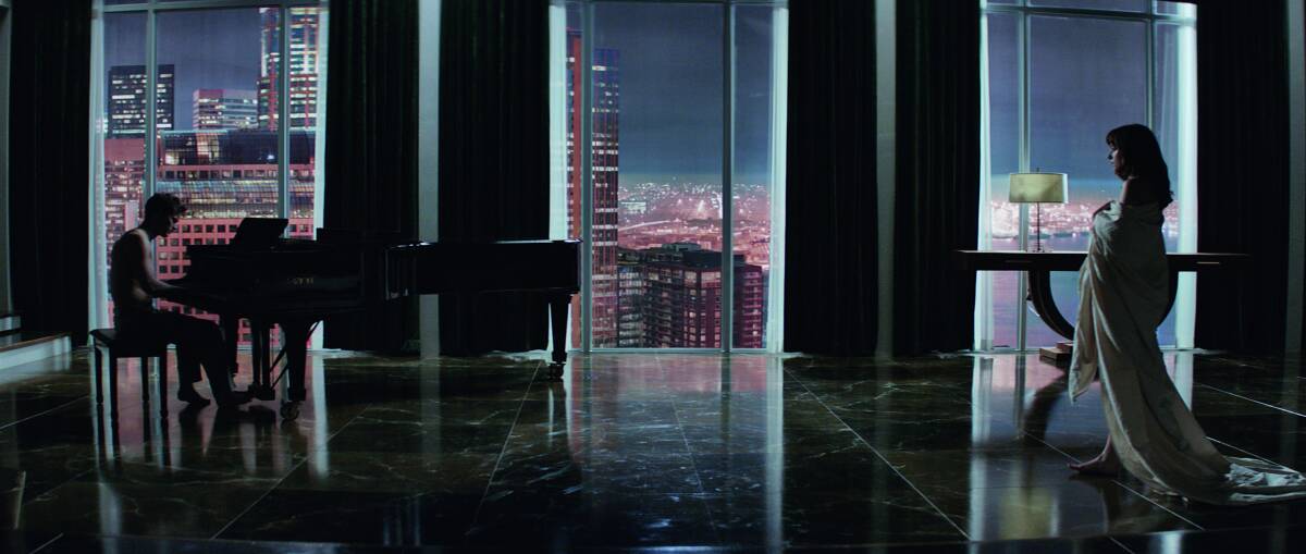 Jamie Dornan and Dakota Johnson in Fifty Shades of Grey. Universal Pictures. Releases 12/2/15