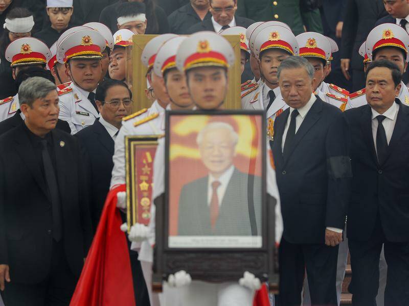 The coffin and smiling portrait of Communist leader Nguyen Phu Trong was paraded in Hanoi. Photo: AP PHOTO