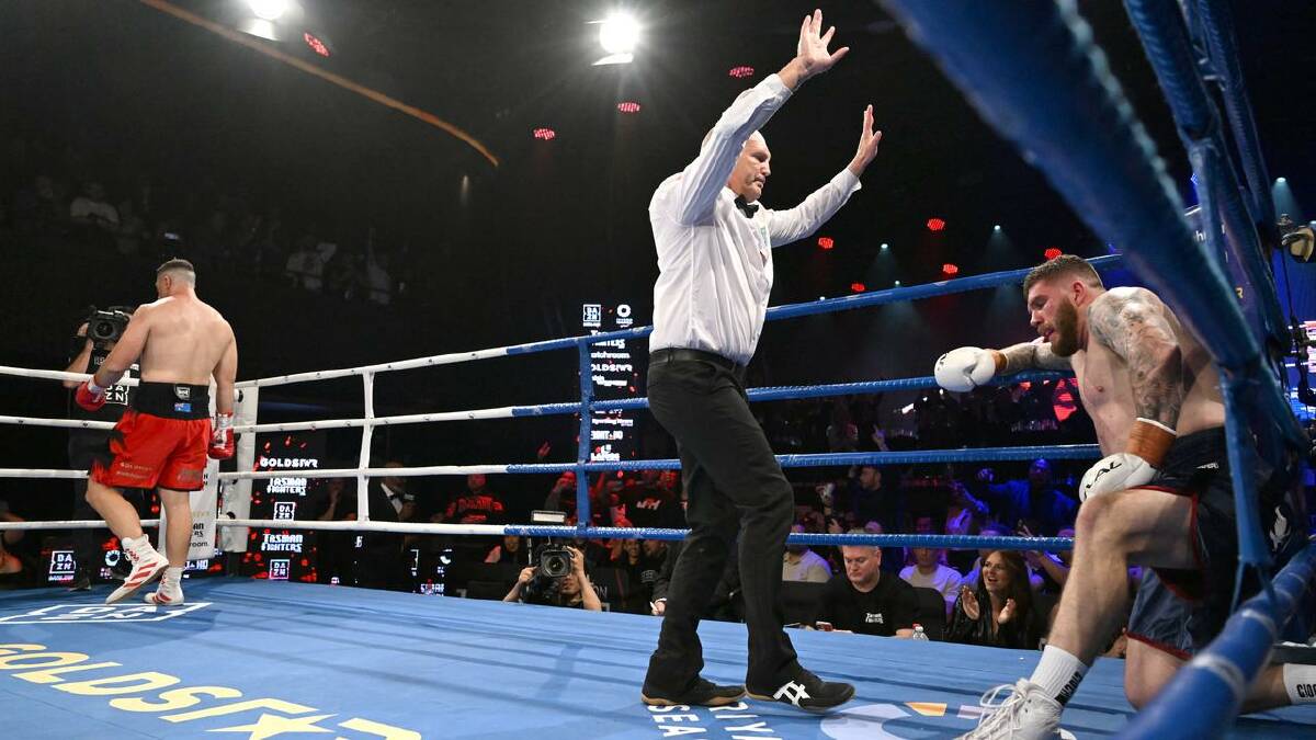 The referee stopped the fight in the second round. (Darren England/AAP PHOTOS)