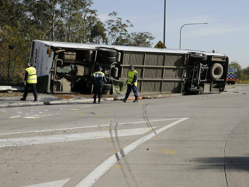 Ten people are dead and 21 others injured after a bus crash in the NSW Hunter Valley. (Darren Pateman/AAP PHOTOS)