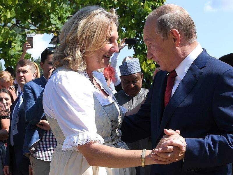 Ex-Austrian foreign minister Karin Kneissl dancing with Vladimir Putin at her wedding in 2018. (AP)