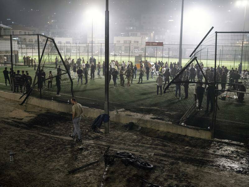 Families in Golan Heights are in mourning after a Hezbollah rocket hit a local football pitch. Photo: AP PHOTO