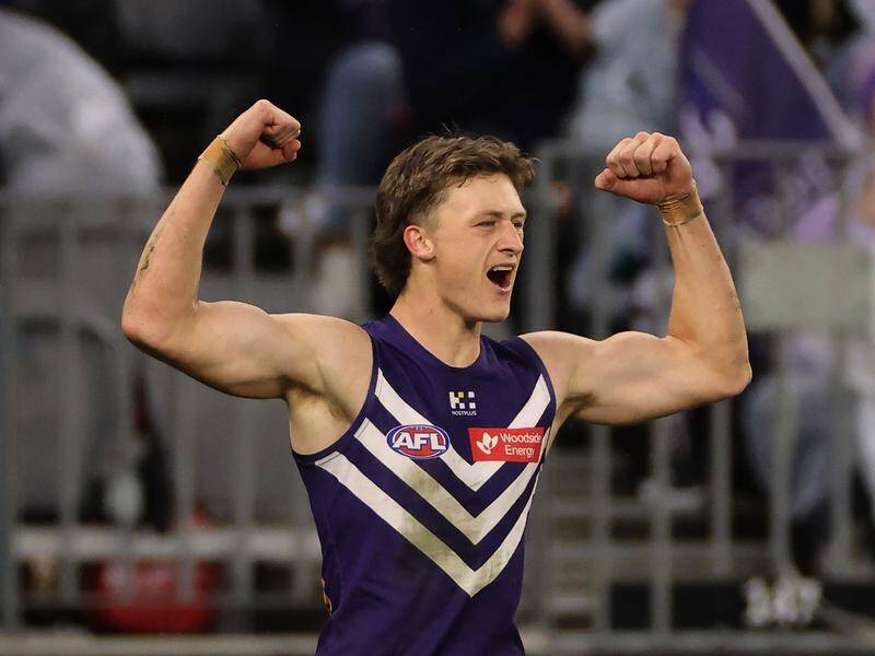 Jye Amiss flexes his muscles after kicking a goal in Perth as Dockers overpowered Tigers. (Richard Wainwright/AAP PHOTOS)