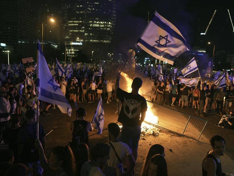 Israeli protesters are vowing to step up pressure on the government over its judicial reforms. (AP PHOTO)