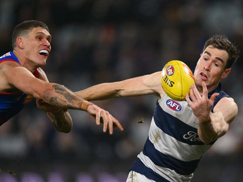 Jeremy Cameron (r) says Geelong are still in the mix despite being soundly beaten by the Bulldogs. Photo: Morgan Hancock/AAP PHOTOS