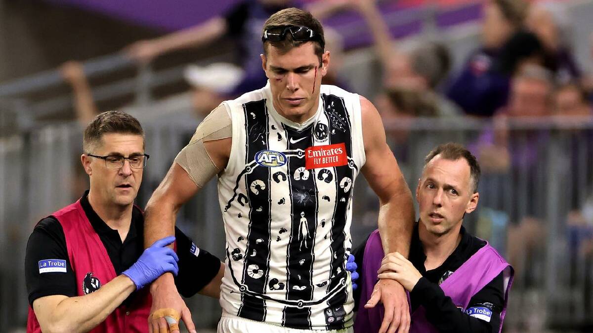 A concussion, along with a knee injury, suffered against Fremantle landed Mason Cox in hospital. (Richard Wainwright/AAP PHOTOS)