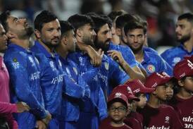 Afghanistan line up before their T20 World Cup semi-final with South Africa last month. (AP PHOTO)