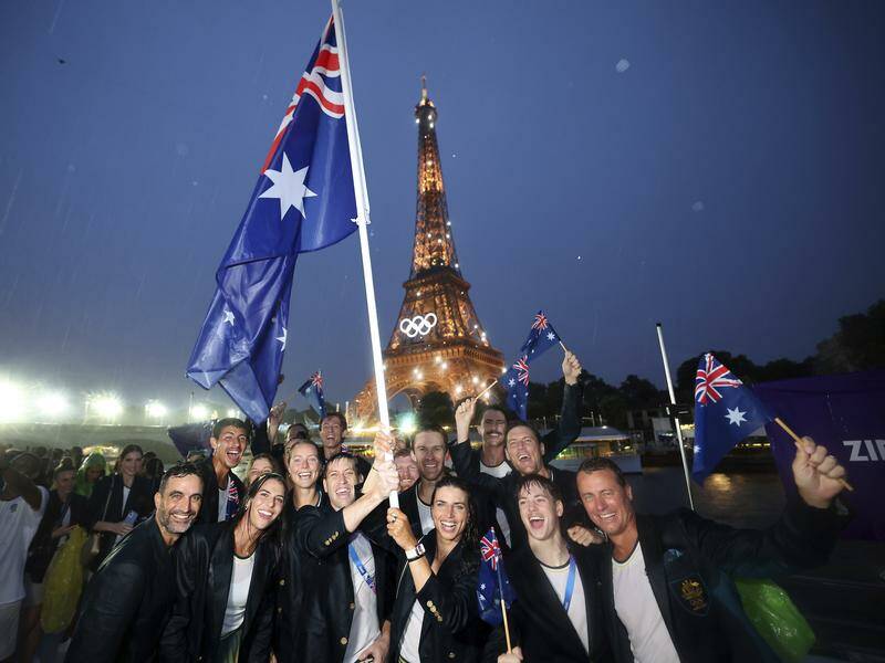Rain did not dampen the spirits of the Australian delegation at the Paris Games opening ceremony. Photo: AP PHOTO