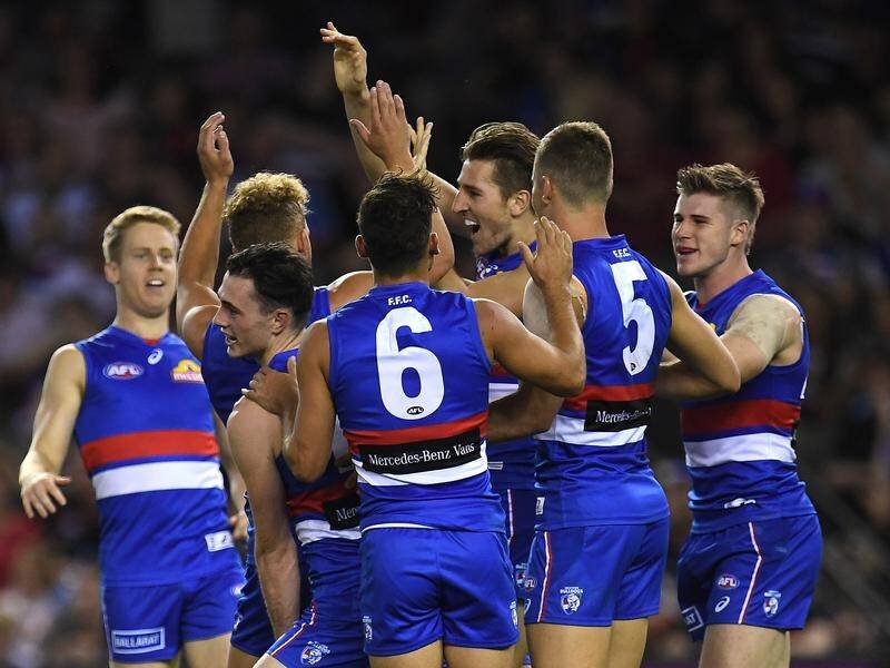 The Western Bulldogs have beaten Essendon by 21 points in their first AFL win of the season.