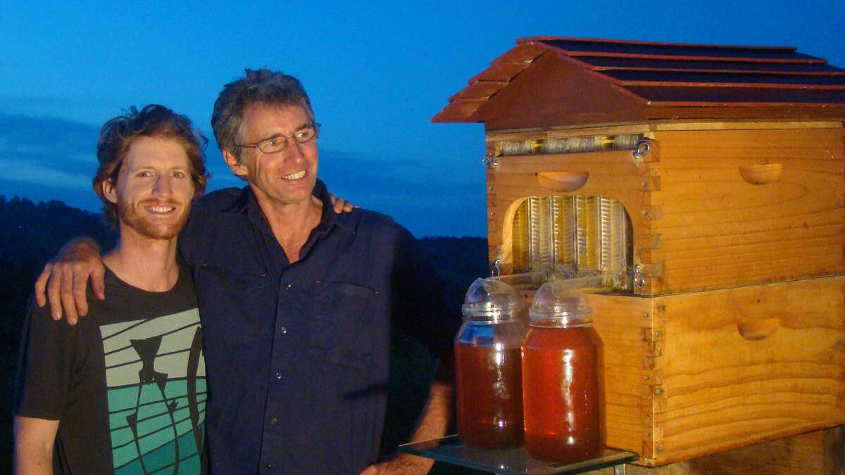 Father and son Stuart and Cedar Anderson with their invention, the 'flow hive'. Picture:  Elizabeth Milne