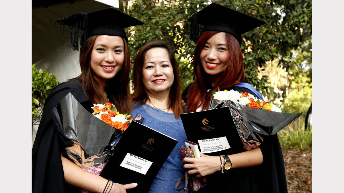 From left Joanne Yip who graduated with a Bach of Engineering in Electrical and sister on right Jessica Yip who graduated with a Bach of Engineering in Mechanical with their mum Nancy Leu. Picture by SIMONE DE PEAK