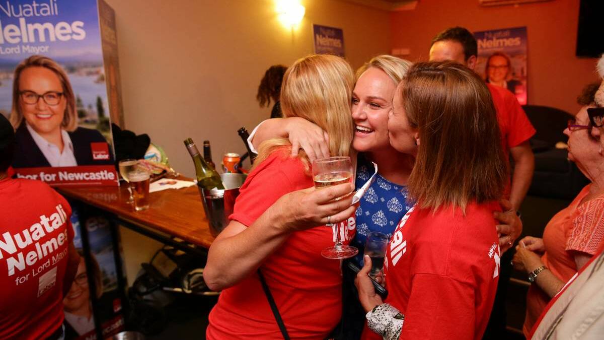SWEET VICTORY: Nuatali Nelmes is congratulated by supporters after winning the vote for Newcastle lord mayor.  Picture: Max Mason-Hubers