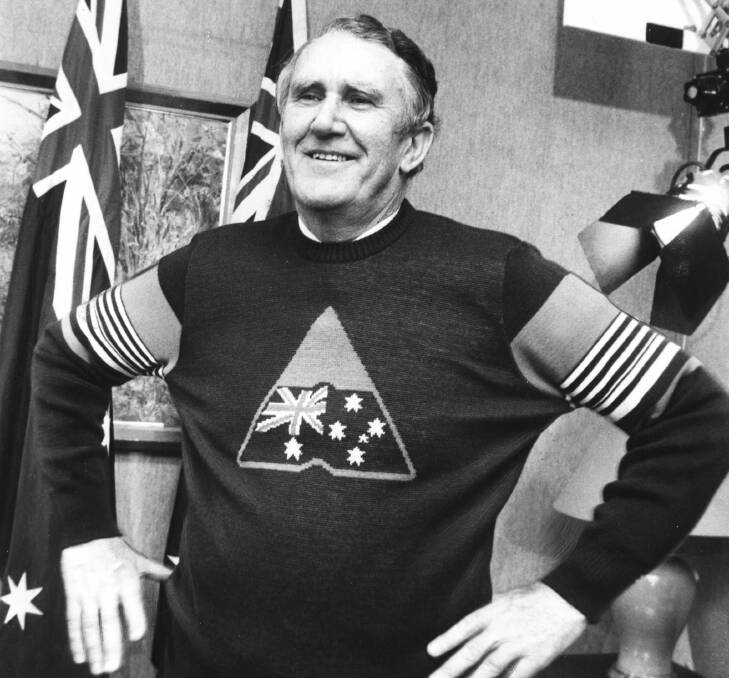 October 1, 1982: Malcolm Fraser tries on an Advance Australia jumper during the filming of his opening speech for the Advance Australia music and dance festival. in Sydney.
