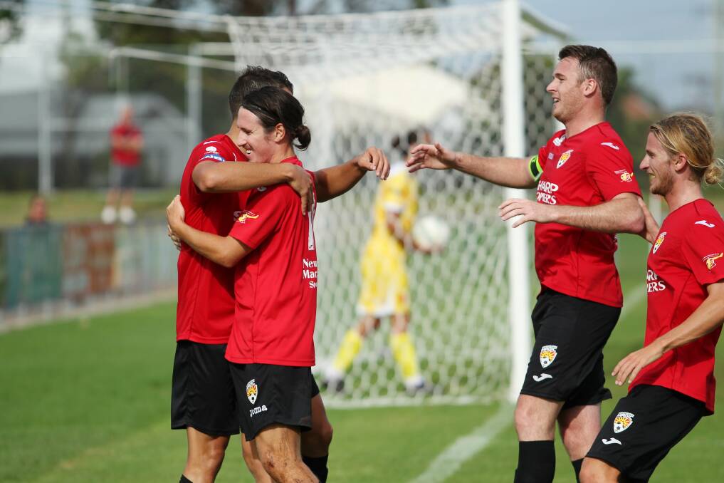 Magic players celebrate a goal against Lambton Jaffas in last year's FFA Cup qualifiers. 