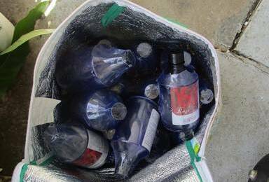 Police searching a home at Speers Point in December 2022 found 55 bottles of industrial chemical 1,4-Butanediol, methamphetamine, and cash. Picture supplied by NSW Police