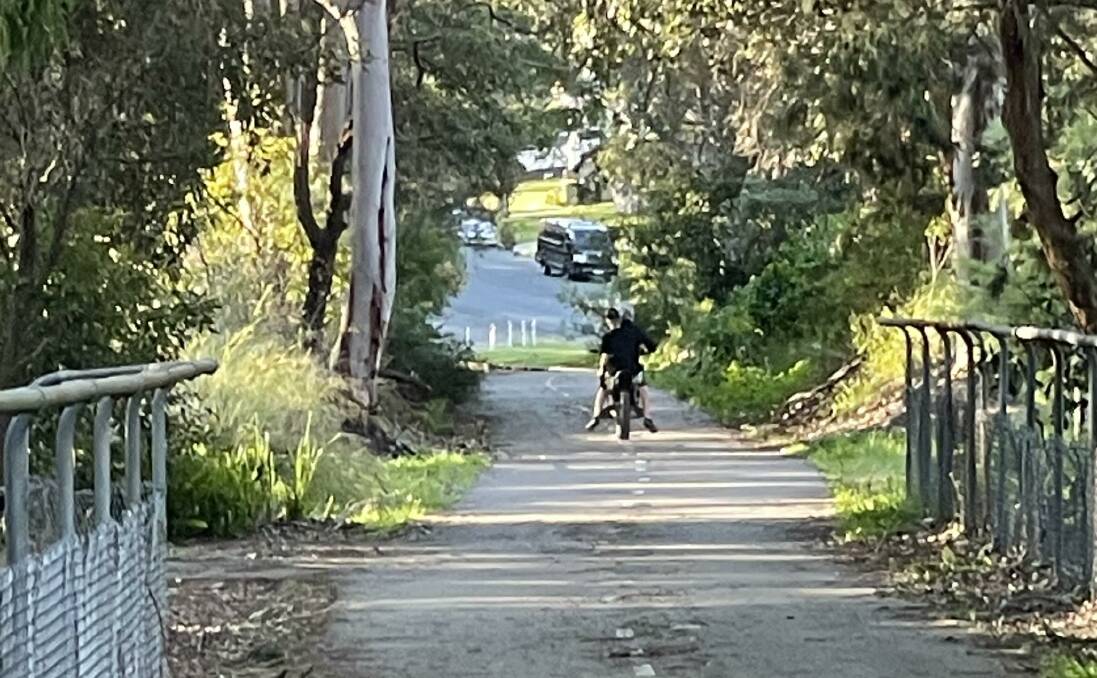 The boys accused of assaulting a 22-year-old woman on the Fernleigh Track at Whitebridge on July 21. She snapped this picture as they took off. Picture supplied