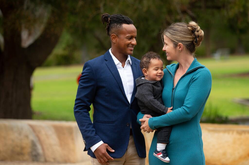 Australian citizen Manu Gilbert with 10 month-old son Louis and fiance Renea Jaeger. Picture by Jonathan Carroll