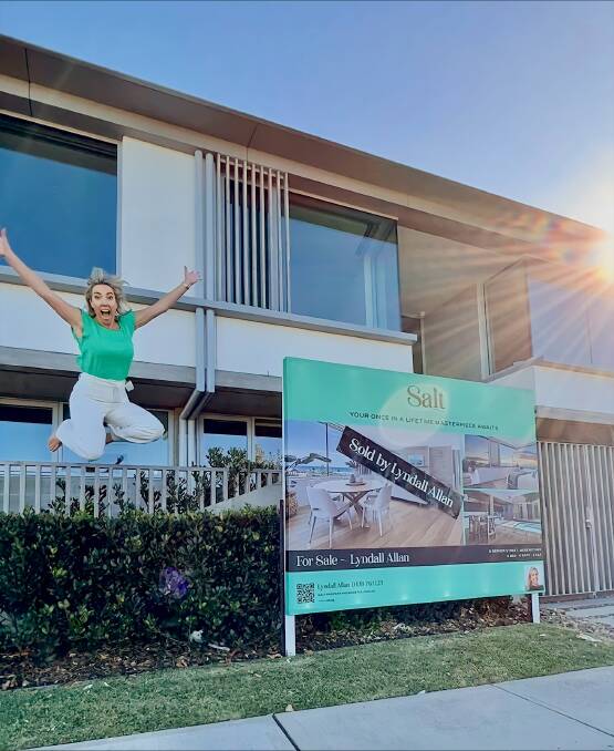 Selling agent Lyndall Allan with the sold sign at the property. Picture supplied
