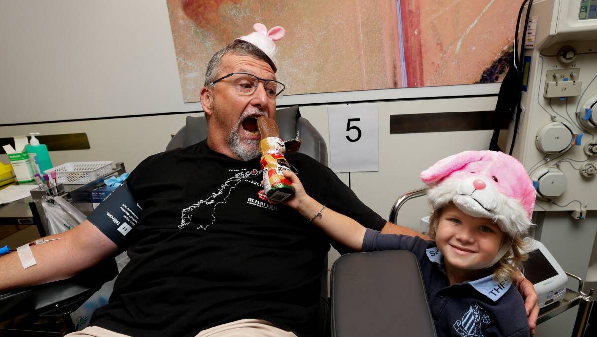 Blood donor of four years Peter Davis, with leukaemia patient Roxy Austin at Newcastle Lifeblood centre in Broadmeadow. Picture by Jonathan Carroll
