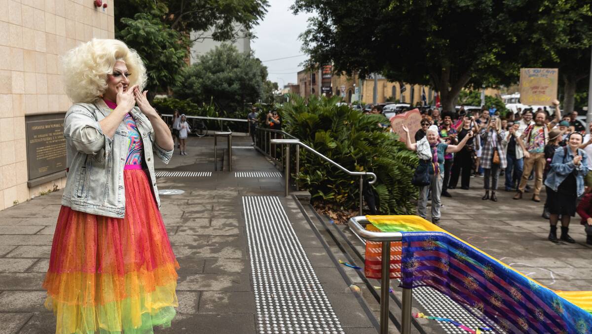 Timberlina was overwhelmed with joy after experiencing 'big love' outside Newcastle Library ahead of Rainbow Storytime. Picture by Marina Neil
