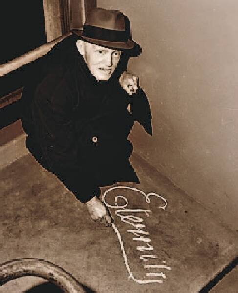 MESSAGE: Arthur Stace writes Eternity in chalk.