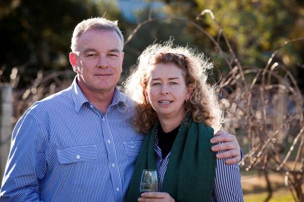 Susan Frazier and Adam Bell in the Whispering Brook vineyard.