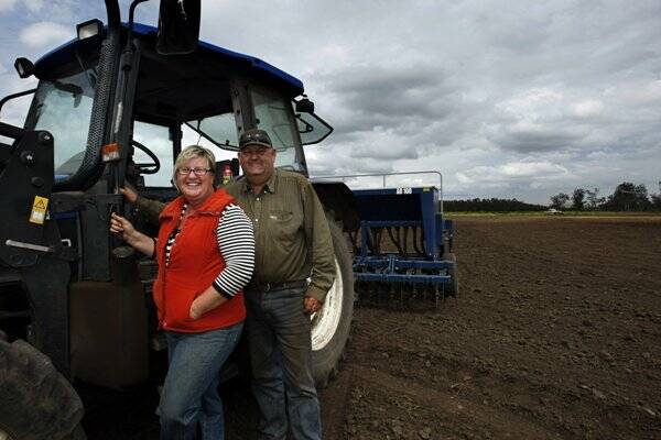 DOING THEIR BIT: Jerrys Plains farmers Paul and Vicki Nichols have just finished sowing a crop of hemp on their property, above, and a hemp crop in the region, below. –  Main Picture by Max Mason-Hubers
