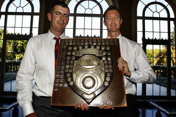THE PRIZE: Merewether captain Simon Moore and Wallsend skipper David Celep yesterday. Picture: Peter Stoop