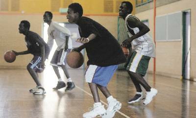 SPORTY IMPORTS: Some of the African refugees training for basketball at Lambton High School.- Picture by Natalie Grono
