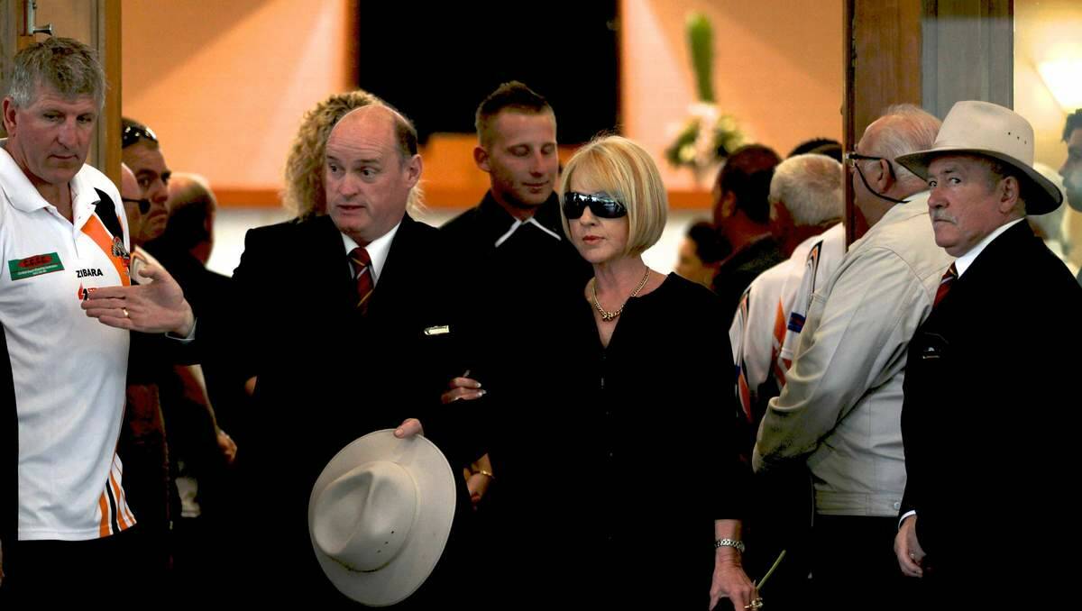 Sue Fowler wife of Graham "Chook" Fowler, centre, at his funeral in Palmdale, on Thursday. Picture Janie Barrett