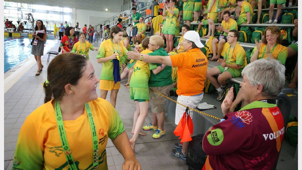 Scenes from the Special Olympics swimming at The Forum pool. The Aussie team reacts after taking out first, second, third and fourth place in the 400 metre freestyle. Picture: Dean Osland. 