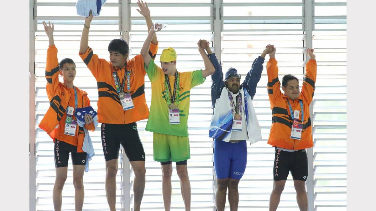 Scenes from the Special Olympics swimming at The Forum pool. Medal presentation for  the 25 meter backstroke. Blake Veaney wins gold. Picture: Dean Osland. 
