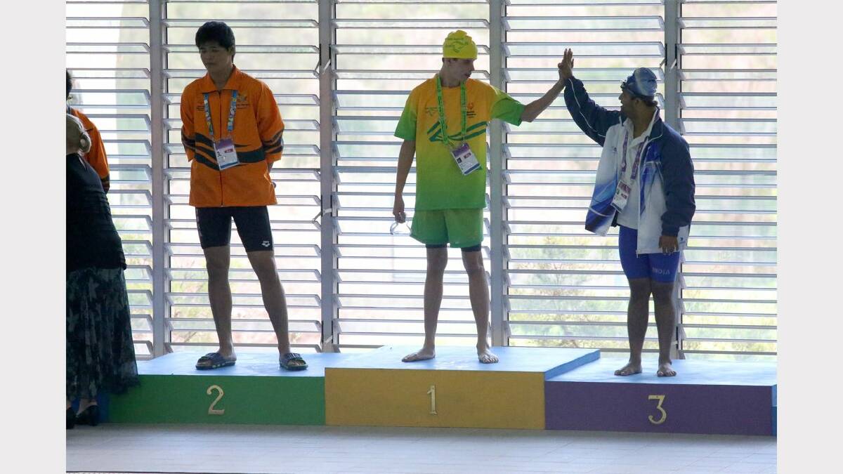 Scenes from the Special Olympics swimming at The Forum pool. Medal presentation for  the 25 meter backstroke. Blake Veaney wins gold. Picture: Dean Osland. 